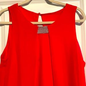 A cute red dress for a party, it sits above the knew. I wore it once in a party